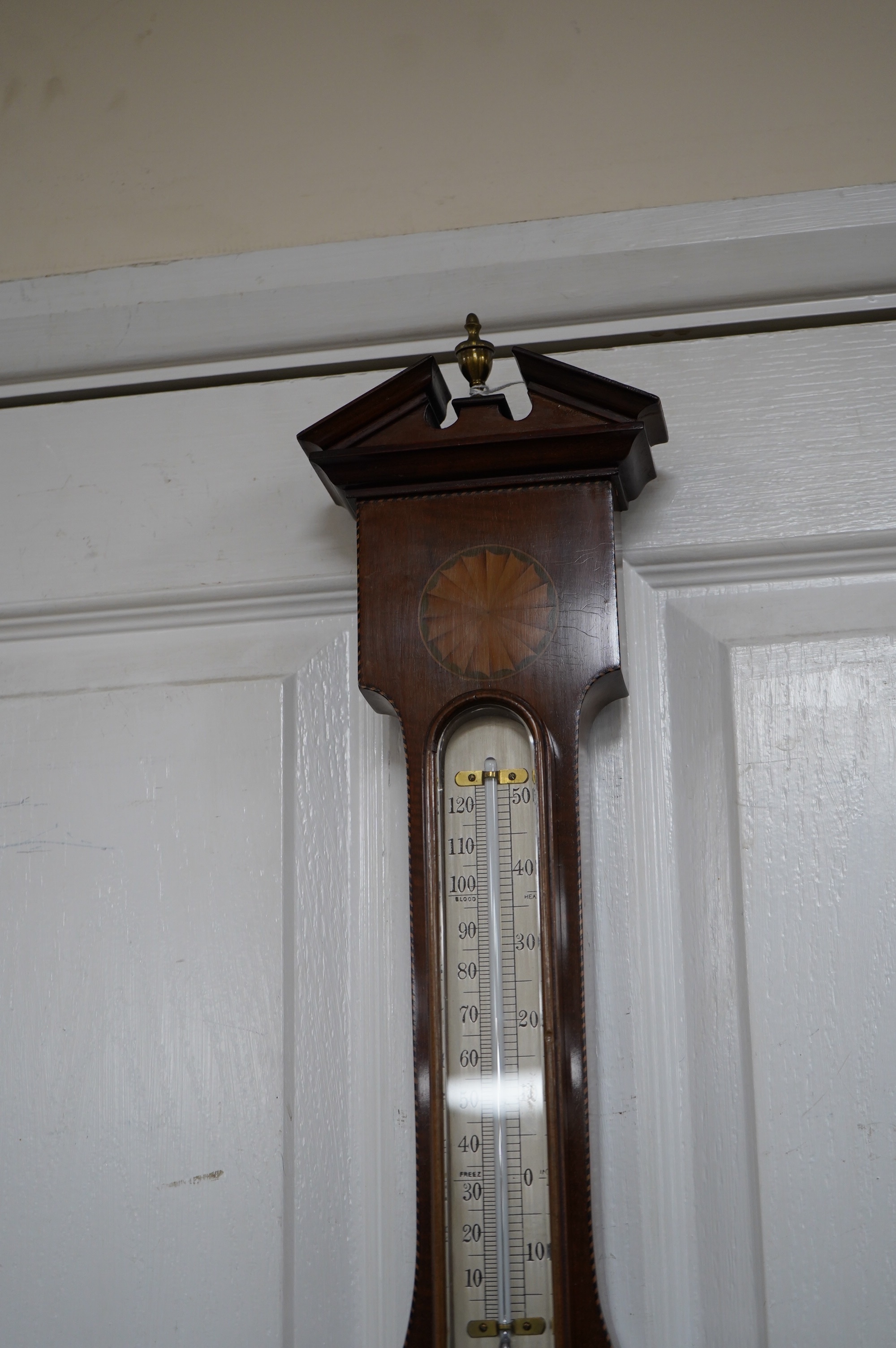 An Edwardian mahogany shell inlaid banjo barometer, maker J Hicks - London, 96cm high. Condition - good